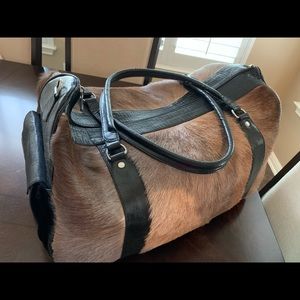 Blesbok fur/genuine leather duffel bag.